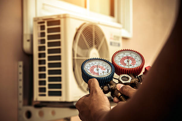 Professional Air Conditioning Service technician working in Custer, SD